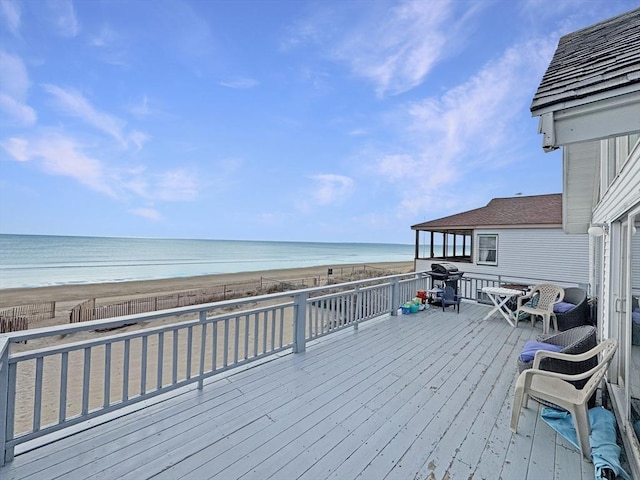 498 N End Blvd, Salisbury, MA 01952 - wooden deck featuring view of water and beach, area for grilling, and a fenced backyard