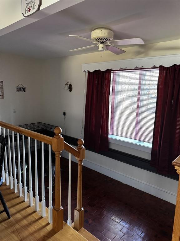 staircase with ceiling fan