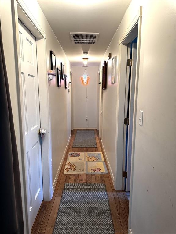 hall featuring wood-type flooring