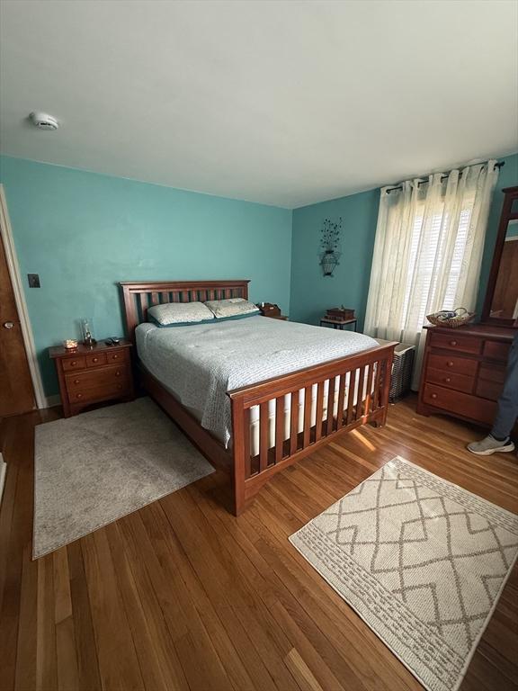 bedroom with wood finished floors