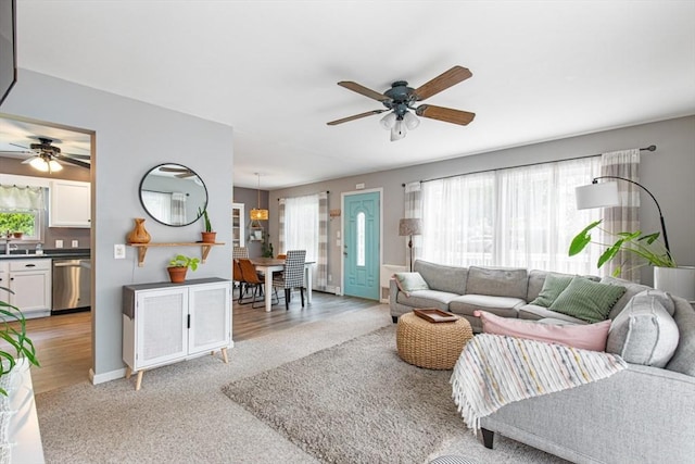 42 Guillotte St, Acushnet, MA 02743 - living room with a ceiling fan, plenty of natural light, and light carpet