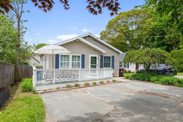 42 Guillotte St, Acushnet, MA 02743 - view of front of home featuring fence and covered porch