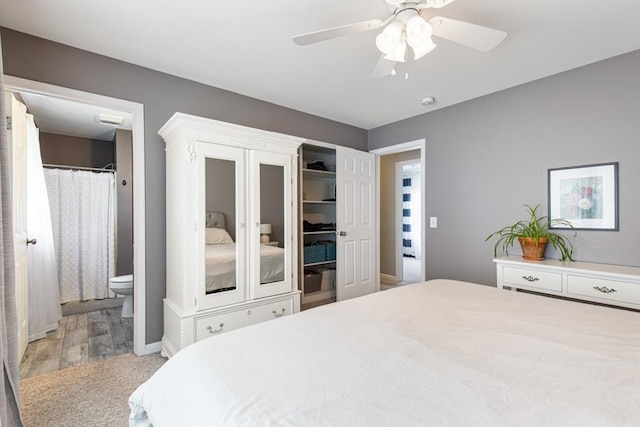 42 Guillotte St, Acushnet, MA 02743 - carpeted bedroom with ensuite bathroom, ceiling fan, and baseboards