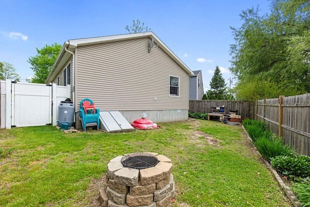 42 Guillotte St, Acushnet, MA 02743 - view of side of home with an outdoor fire pit