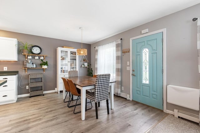42 Guillotte St, Acushnet, MA 02743 - dining room featuring light wood finished floors, baseboard heating, and baseboards