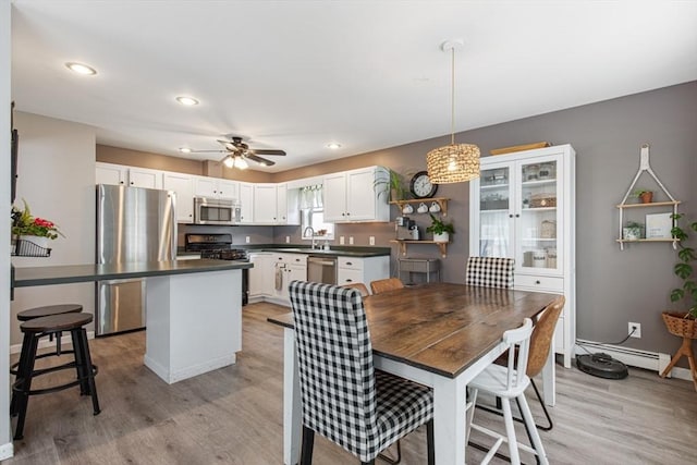 42 Guillotte St, Acushnet, MA 02743 - dining room with light wood-style flooring, a ceiling fan, recessed lighting, and baseboards