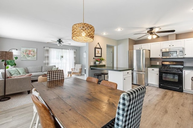 42 Guillotte St, Acushnet, MA 02743 - dining space featuring ceiling fan and light wood-style floors