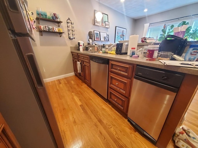 279-279A Dorchester St, Boston, MA 02127 - bar featuring stainless steel dishwasher, light wood-type flooring, recessed lighting, hanging light fixtures, and baseboards
