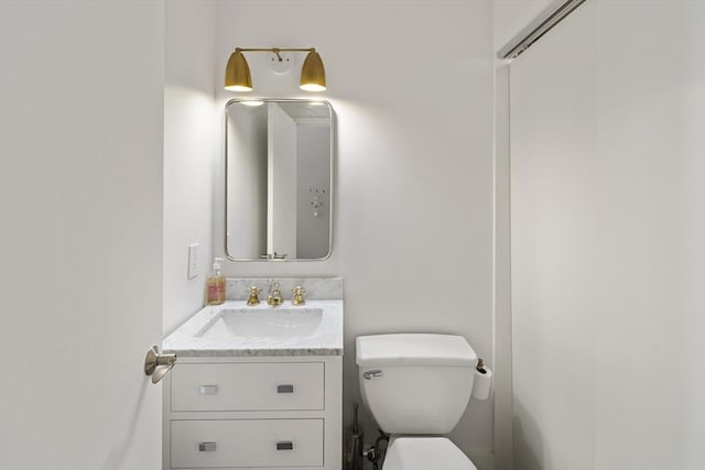 half bath with toilet and vanity