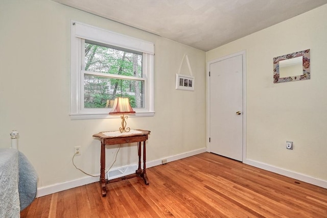 entryway with light wood-type flooring and baseboards