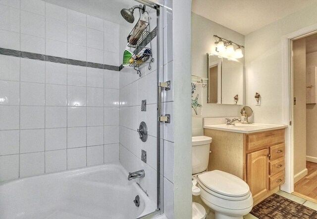 full bath with toilet, vanity, and shower / tub combination