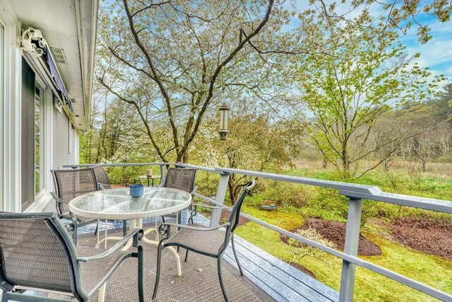 balcony with outdoor dining area