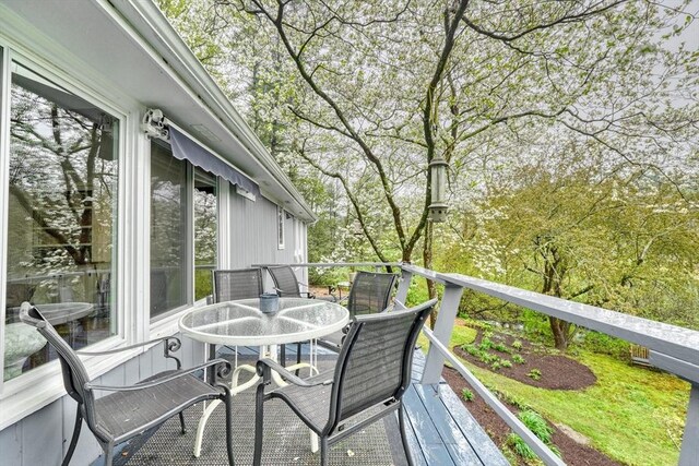 deck with outdoor dining area