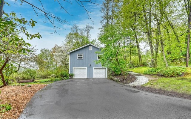 view of home's exterior with driveway and an attached garage