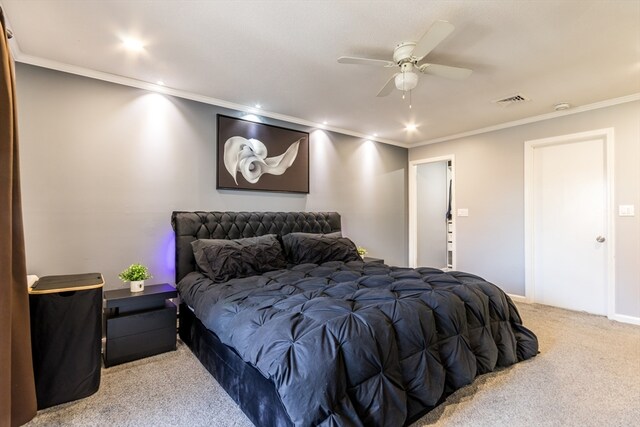 bedroom featuring ceiling fan, light colored carpet, and crown molding