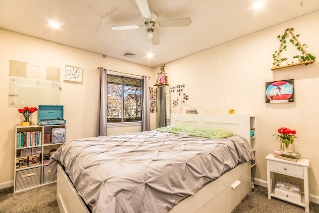 bedroom featuring ceiling fan and dark carpet