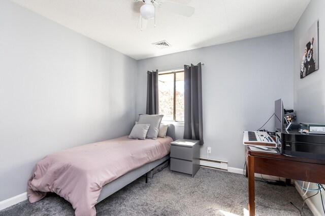 carpeted bedroom with baseboard heating and ceiling fan