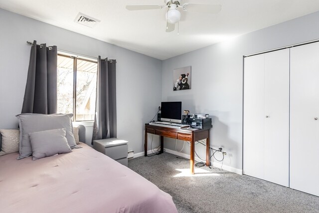 carpeted bedroom with ceiling fan and a closet