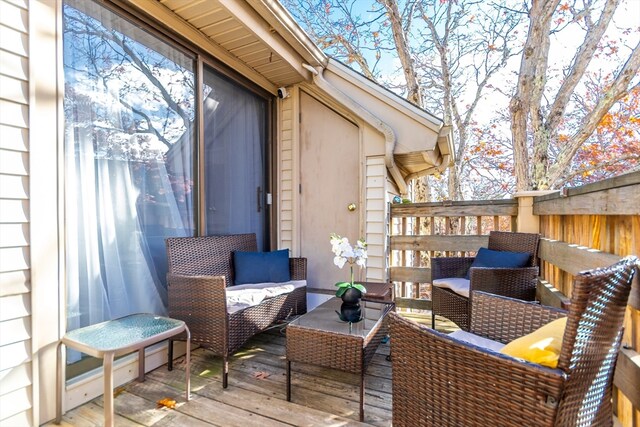 wooden deck with an outdoor hangout area