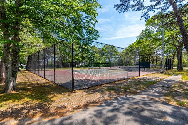 view of basketball court featuring tennis court