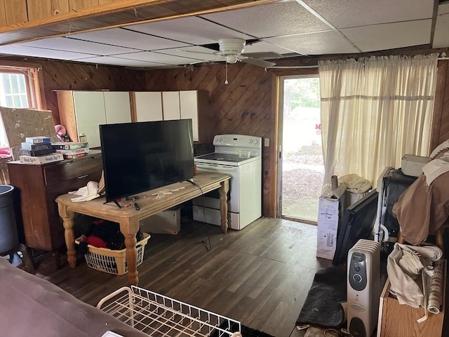 19 Wheelhouse Cir, Falmouth, MA 02536 - living room with dark wood-type flooring, a ceiling fan, a drop ceiling, wood walls, and healthy amount of natural light