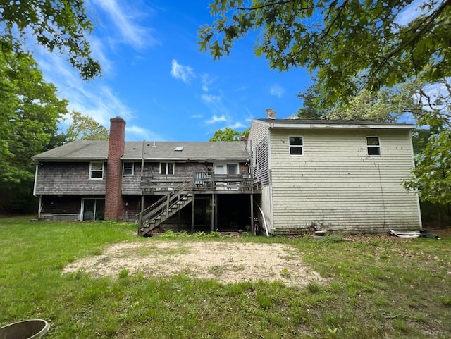 19 Wheelhouse Cir, Falmouth, MA 02536 - back of property with a wooden deck, stairway, a chimney, and a yard
