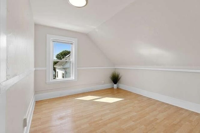 9 Foster St Unit 2, Gloucester, MA 01930 - additional living space with lofted ceiling and wood finished floors