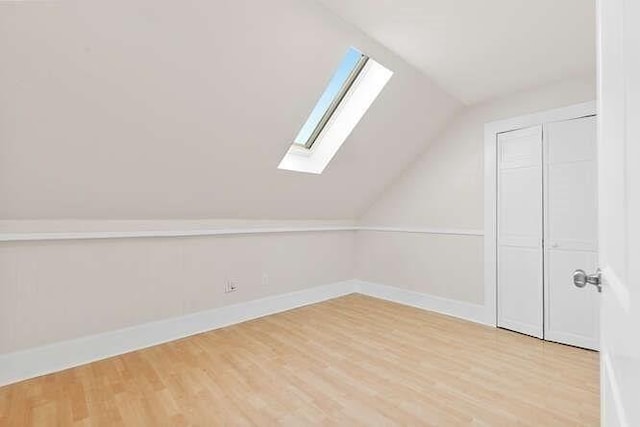 9 Foster St Unit 2, Gloucester, MA 01930 - bonus room featuring a skylight, light wood-style floors, and vaulted ceiling