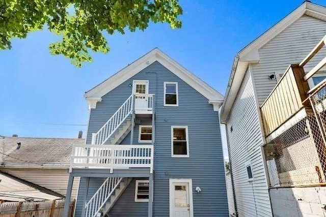 9 Foster St Unit 2, Gloucester, MA 01930 - back of house featuring stairway and a wooden deck
