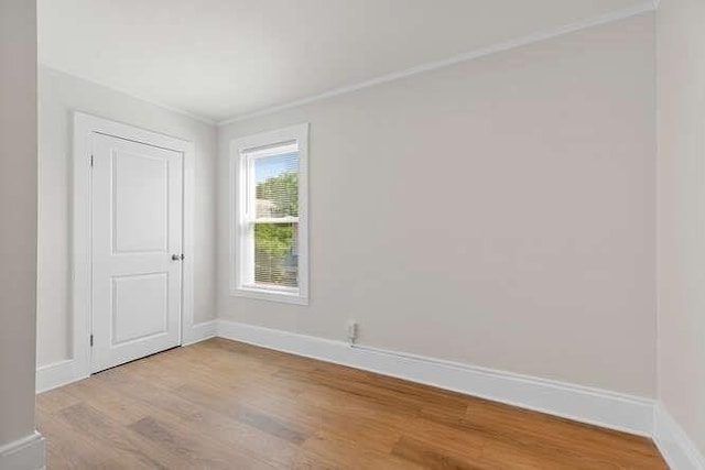 9 Foster St Unit 2, Gloucester, MA 01930 - spare room with light wood finished floors and ornamental molding