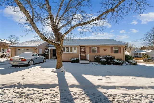 single story home featuring a garage