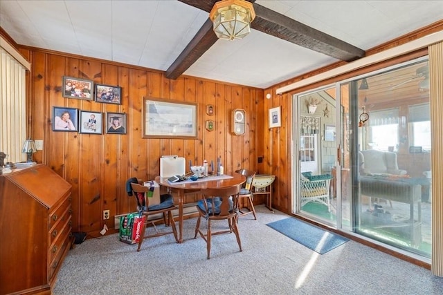 carpeted home office with beamed ceiling