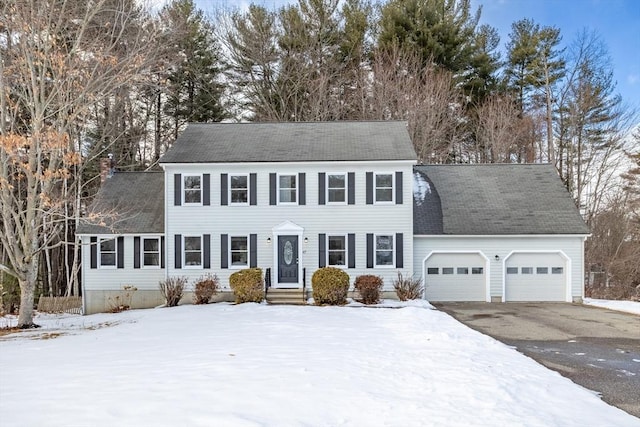 colonial inspired home featuring a garage