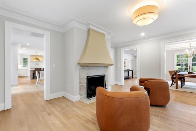 2 Percy Rd, Lexington, MA 02421 - living room with a fireplace, light wood-style floors, baseboards, ornamental molding, and recessed lighting