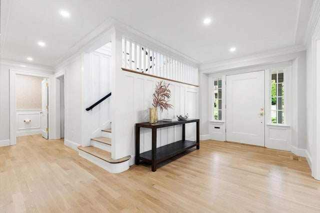 2 Percy Rd, Lexington, MA 02421 - foyer entrance with ornamental molding, a decorative wall, stairs, light wood-style floors, and recessed lighting