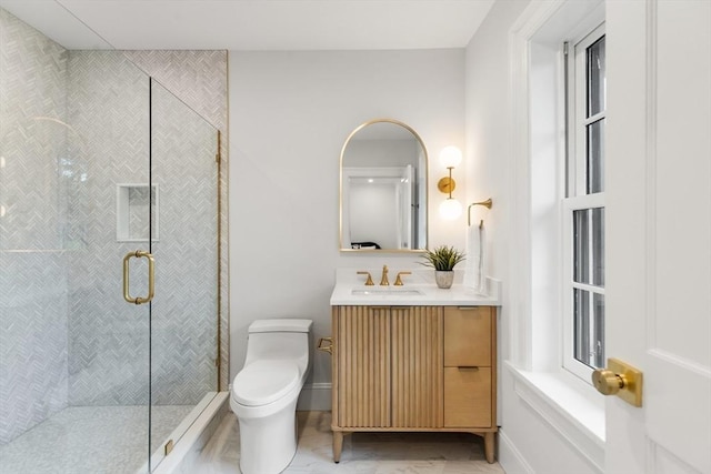 2 Percy Rd, Lexington, MA 02421 - full bathroom featuring marble finish floors, vanity, toilet, a shower stall, and baseboards