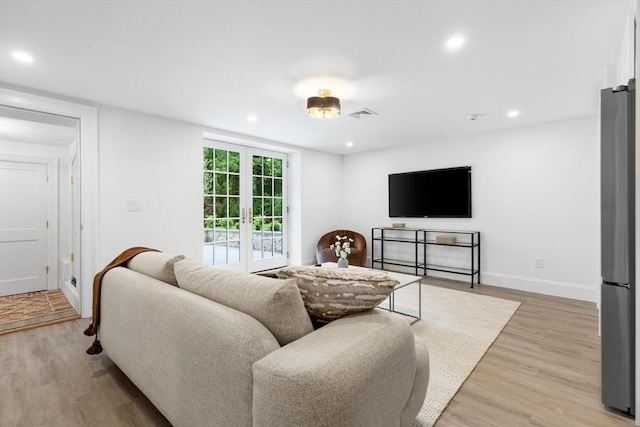 2 Percy Rd, Lexington, MA 02421 - living area featuring light wood-style flooring, recessed lighting, baseboards, and french doors