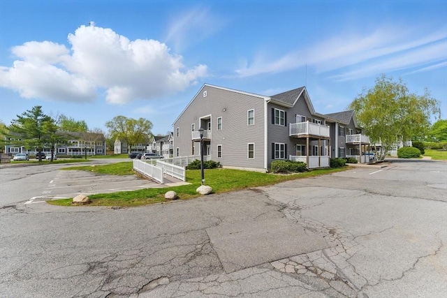 450 Somerset Ave Unit 3-6, Taunton, MA 02780 - view of home's exterior with uncovered parking and a residential view