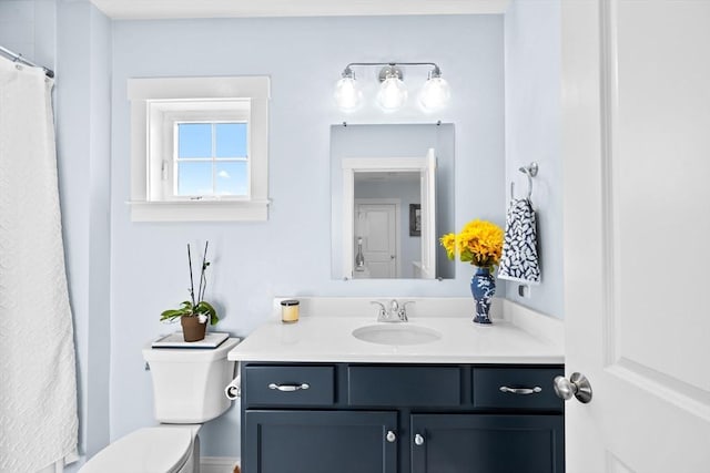 bathroom with vanity and toilet