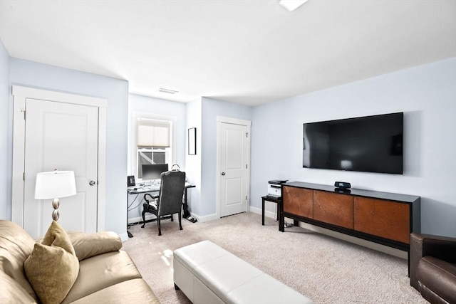 carpeted living room with visible vents and baseboards