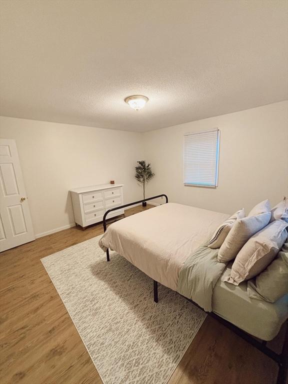 bedroom featuring hardwood / wood-style floors