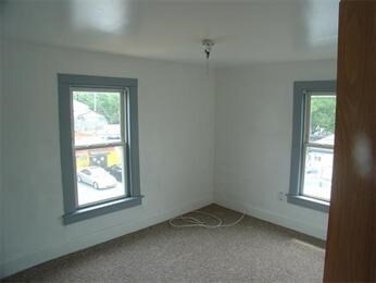 empty room with carpet flooring