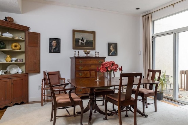 303 Goddard Ave Unit 303, Brookline, MA 02445 - dining area featuring ornamental molding, light wood finished floors, and baseboards