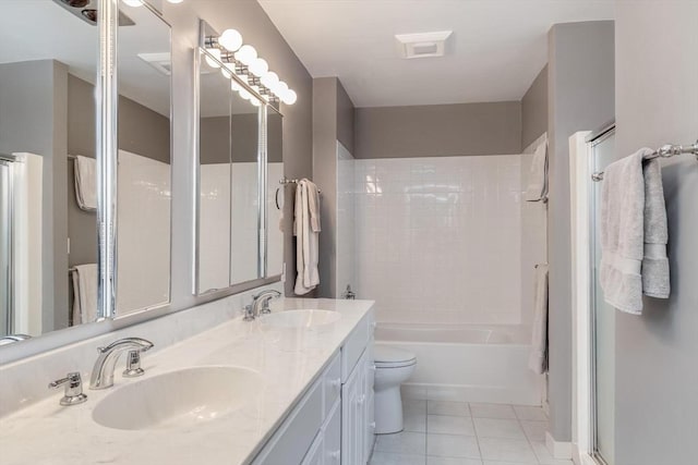 303 Goddard Ave Unit 303, Brookline, MA 02445 - full bath featuring tile patterned floors, double vanity, toilet, and shower / bathtub combination