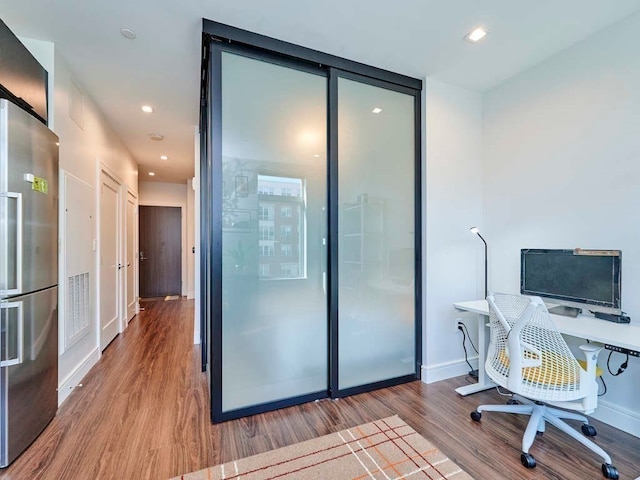 office area with wood-type flooring