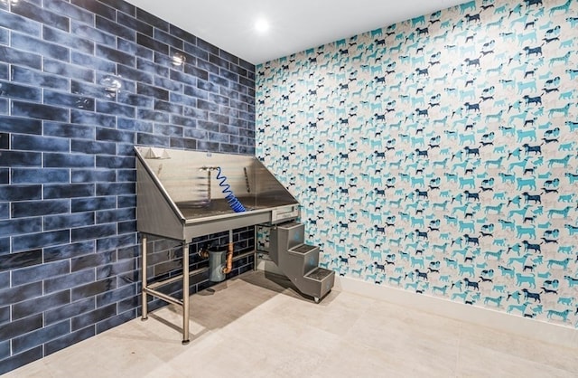 miscellaneous room with tile patterned floors