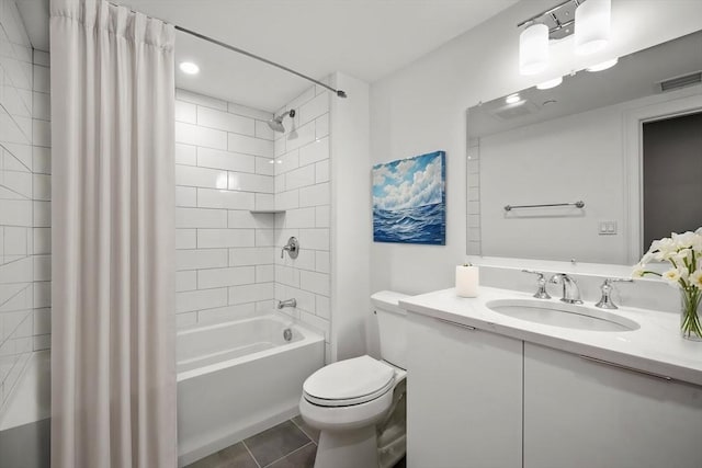 full bathroom featuring tile patterned flooring, visible vents, toilet, shower / tub combo, and vanity