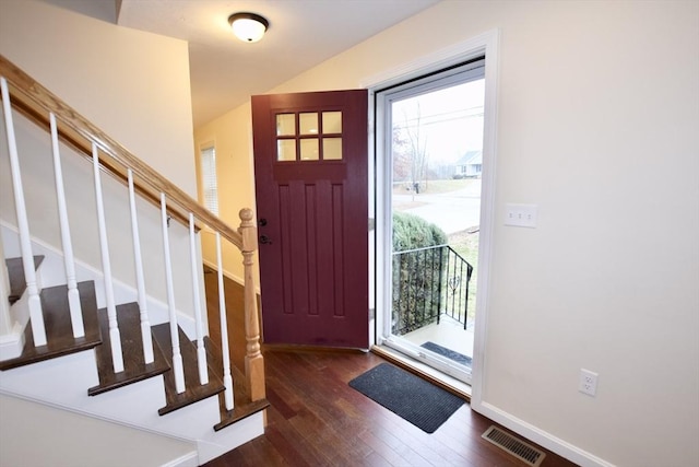 foyer entrance with plenty of natural light and dark wood-type flooring