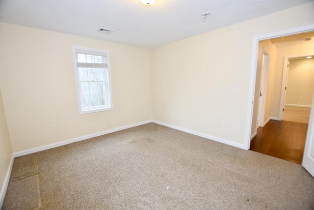 empty room with carpet flooring