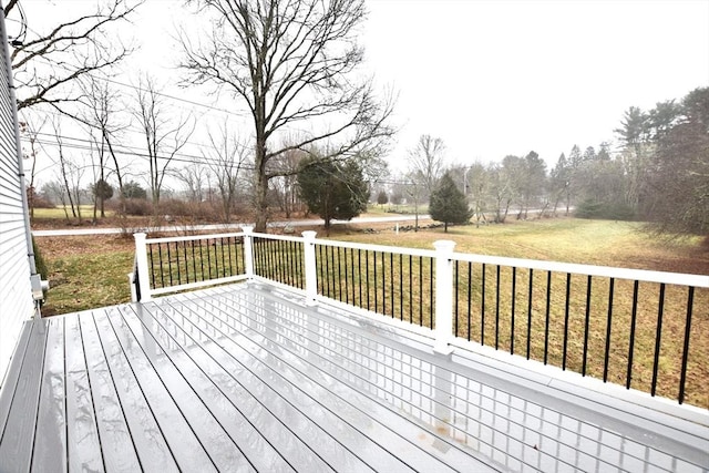 wooden deck with a lawn